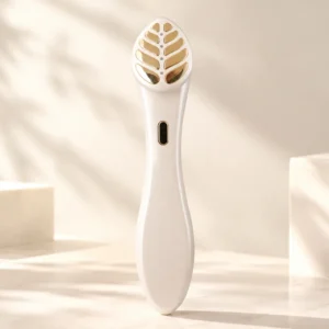 Dual eye and face skincare beauty device featuring a gold-plated leaf-shape probe, EMS microcurrent, red light, vibration, and 40℃ heating.