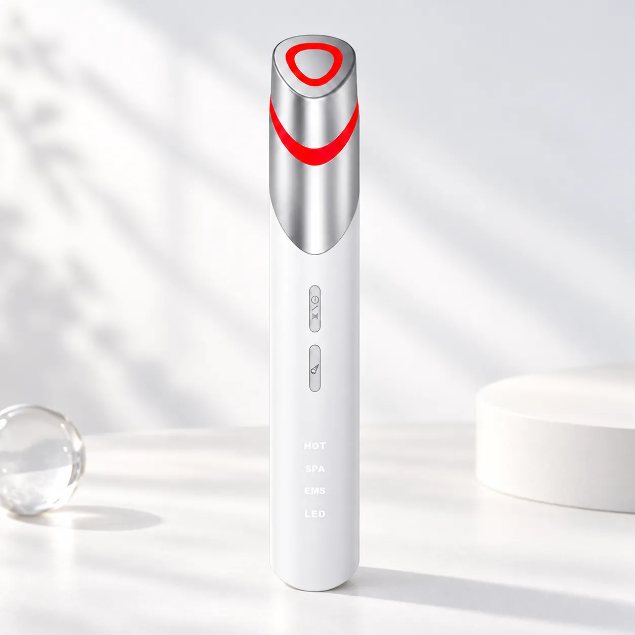 Portable EMS hot compress eye care massage wand with red LED light ring and dual-button controls.